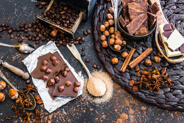 chocolate, cocoa and various spices on table
