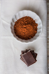 Cube of chocolate and a bowl of cocoa