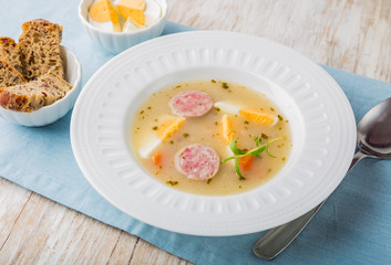 Borscht with eggs and white sausage.(Polish easter soup)