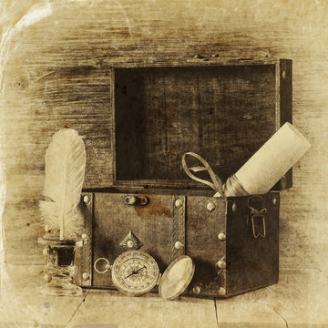 Antique compass, inkwell and old wooden chest