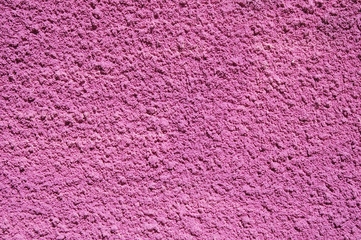Pink decorative relief plaster on wall