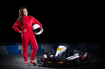 Fototapeta na wymiar Young girl karting driver