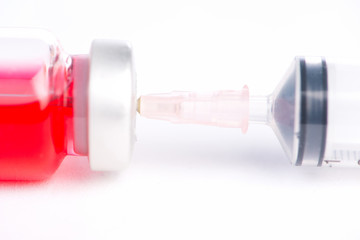 Injection syringe put in medicine vial show medicine concept