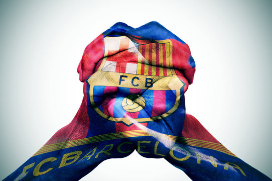 man hands patterned with the flag of the Futbol Club Barcelona