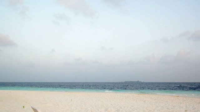 Sand beach and ocean wave, South Male Atoll. Maldives