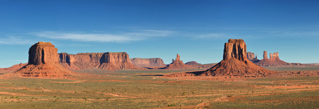 Monument Valley at sunrise, desert canyon in USA, panoramic image