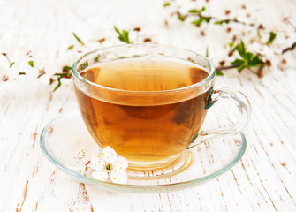 Cup of tea and spring blossom