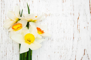 Daffodils on a wooden background