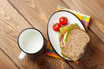 Sandwich with salad, ham, cheese and tomatoes