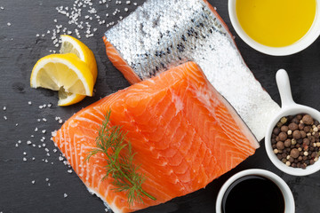 Salmon and spices on stone table