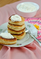 Obraz na płótnie Canvas Delicious homemade pancakes with sour cream.