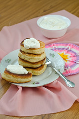 Fototapeta na wymiar Delicious homemade pancakes with sour cream.