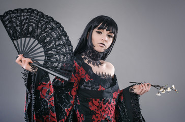 Attractive and sexy lady with hand fan