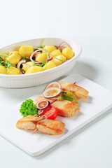 Fish skewer and potatoes