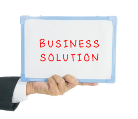Business solution text on white board