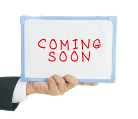 Coming soon text on white board