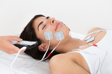 Therapist Giving Electrodes Therapy