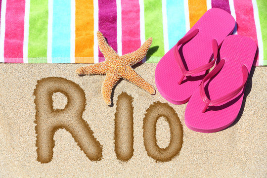 Rio beach vacation concept - flip flops and towel