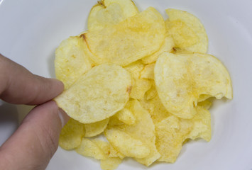 finger take potato chip