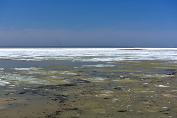 snow melting on the river in the spring