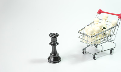 Black queen and white pawn inside trolley