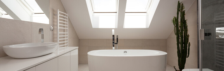 White bathroom with modern bath