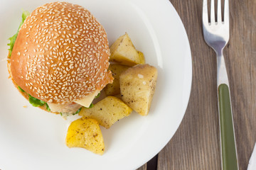 Cheeseburger with turkey and potato wedges top view
