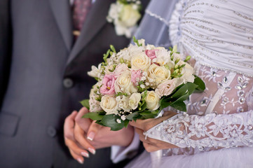 Bride and groom holding hands