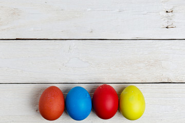 Easter eggs isolated on white wooden surface