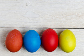 Easter eggs isolated on white wooden surface