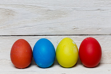 Easter eggs isolated on white wooden surface