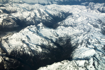 Fototapeta premium View from the airplane at Alps under show