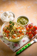 vegetarian couscous with mozzarella tomatoes and pesto sauce