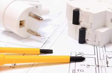 Screwdriver, electric plug and fuse on construction drawing