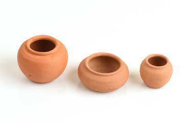 Clay pots on white background