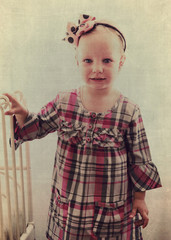 Portrait of beautiful little girl in vintage style. 