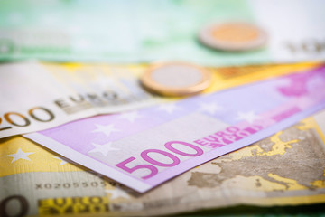 Closeup of euro banknotes and coins