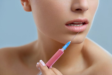 Beautiful Woman Gets Lips Injections. Cosmetology. Beauty Face