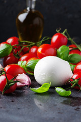Concept of italian food with mozzarella, tomato and basil