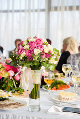 Bridal bouquet on the wedding table