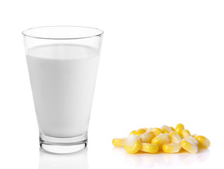 fresh milk in the glass with corn on white background