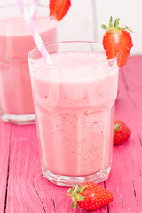 strawberry smoothie on pink table
