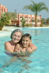 Fototapeta na wymiar Grandma and grandson in pool