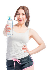 happy girl holds a bottle of drinking water