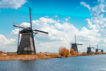 Dutch windmills with canal reflections at Kinderdijk, Netherland