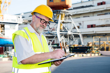 Engineer at a construction site in the port
