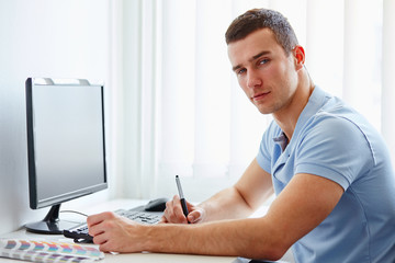 Graphic designer working on digital tablet