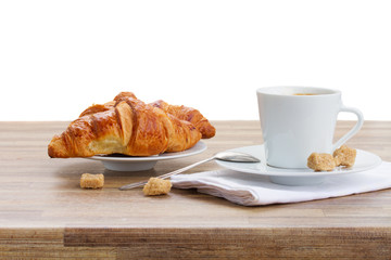 cup of coffee with croissant