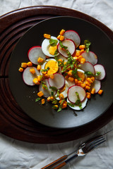 easy summer salad: radishes, eggs, corn.