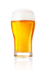 Glass of fresh beer with cap of foam isolated on white backgroun